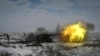 A Russian soldier fires a howitzer during drills at the Kuzminsky range in the southern Rostov region on January 26.