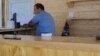 Armenia -- Parliament deputy Hayk Sargsian is seen sitting behind the bar at a beach club, July 26, 2020.