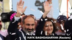 ARMENIA - Newly elected Prime Minister of Armenia Nikol Pashinian (L) greets supporters during a meeting in Republic Square in Yerevan, Armenia May 8, 2018