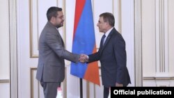 Armenian parliament speaker Ara Babloyan (right) and Syrian Ambassador Muhammad Haj Ibrahim meet in Yerevan on September 3.