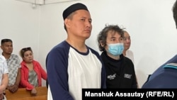 Qosai Makhanbaev appears in court in Almaty in June.