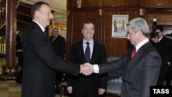 Russian President Dmitry Medvedev (center) at a meeting with his Armenian and Azerbaijani counterparts, Serzh Sarkisian (right) and Ilham Aliyev, in Sochi on January 23