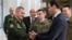 Министр обороны России Сергей Шойгу встречается с Башаром Асадом во время очередного визита в Дамаск – без всяких защитных масок. 23 марта