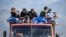 Armenia - Refugees from Nagorno-Karabakh ride in a truck upon their arrival at the border village of Kornidzor, September 27, 2023. 