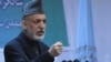 Afghan President Hamid Karzai speaks during a gathering in Kabul on April 17.