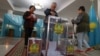 Voters cast their ballots at a polling station in the capital, Nur-Sultan, on June 5.