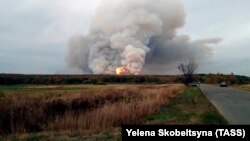 Smoke and fire are seen at the stricken ammunition depot in Russia's western Ryazan region.