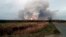 Smoke and fire are seen at the stricken ammunition depot in Russia's western Ryazan region.