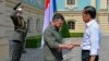 Indonesian President Joko Widodo (right) and Ukrainian President Volodymyr Zelenskiy shake hands during Widodo's visit to Kyiv on June 29.