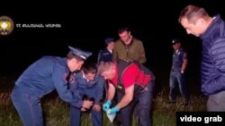 Armenia - Investigators inspect the scene of a deadly shooting in Aparan, June 19, 2022.