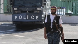 Armenia - One of the opposition gunmen occupying a police station in Yerevan, 23Jul2016.