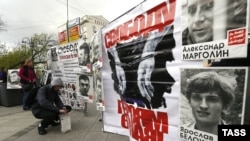 Portraits of Russian opposition protesters are displayed during a silent opposition rally in central Moscow on May 6.