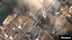 Фукусима шаарындагы Дайичи өзөктүк ишканасынын 3-реактору жарылуудан кийин. 14-март, 2011-жыл. Сателлиттен тартылган сүрөт. DIGITAL GLOBE REUTERS/Digital Globe/Handout .
