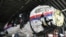 Судьи осматривают реконструированный корпус рейса MH17 Malaysia Airlines на авиабазе Гильзе-Риджен в Нидерландах 26 мая