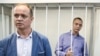 Ivan Safronov (right) and his lawyer Ivan Pavlov appear at a court hearing in Moscow in July 2020.