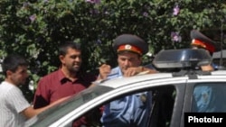 Armenia -- Traffic police fine a motorist.