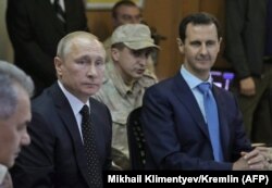 Владимир Путин и Башар Асад на авиабазе Хмеймим в провинции Латакия. Декабрь 2017 года.