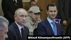 Президенттер Путин жана Асад Сириянын Хмеймим аскер базасында жолукканда. 11-декабрь, 2017-жыл. 