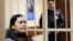 Russia -- Gulchekhra (Gyulchekhra) Bobokulova, a nanny suspected of murdering a child in her care, sits inside a defendants' cage as she attends a court hearing in Moscow, March 2, 2016