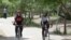 Iran -- Women on bicycle in a park Iran, Apr2011