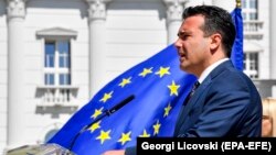 Macedonian Prime Minister Zoran Zaev addresses journalists during a press conference to mark the first year of his government's work in front of the government building in Skopje on May 30.