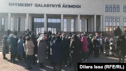 Women gather outside the Shymkent administration building on November 23. 