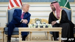US President Donald Trump and Saudi Crown Prince Muhammed Bin Salman talk before a coffee ceremony at the Royal Court in Riyadh on May 13.