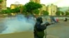 Venezuelan Police Fire Tear Gas At Antigovernment Protesters