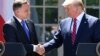 U.S. President Donald Trump (right) and Polish President Andrzej Duda shake hands after holding a joint press conference in the Rose Garden of the White House in Washington on June 12.