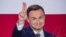 Анджей Дуда — кандидат в президенты от партии "Право и справедливость" — выигрывает президентские выборы в Польше. Варшава, 24 мая 2015 года.