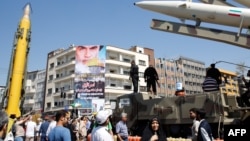 An Iranian Shahab-3 missile (left) is displayed during a rally in Tehran in June 2017.