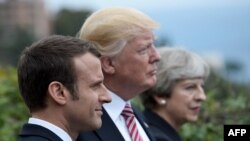 Франциянын президенти Эммануэл Макрон, АКШ президенти Дональд Трамп, Британиянын премьер-министри Тереза Мэй. 