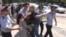 Полиция задерживает участников акции протеста у АТФ Банка. Алматы,15 июля 2014 года. 