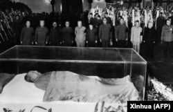 Party and state leaders stand vigil before the remains of Mao Zedong on September 13, 1976.