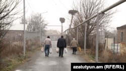 Armenia - People walk on a street in the village of Ranchpar, December 13, 2024.