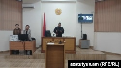 A judge reads out the sentence at the conclusion of the trial of Russian soldier Andrey Razgildeyev in Gyumri, Armenia, November 12, 2025.