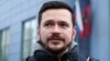 Ilya Yashin speaks to reporters outside a court in Moscow in January.
