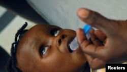 Вакцинация детей в госпитале в Порт-о-Пренсе