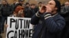 Anti-Putin demonstrators rally in Yerevan on December 2.