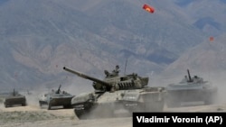 Kyrgyz tanks roll during CSTO military exercises at the Edelweiss training ground in Kyrgyzstan on September 9.