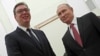 Russian President Vladimir Putin (right) meets with Serbian President Aleksandar Vucic at the Kremlin in Moscow on December 19.