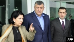 Opposition leaders Salome Zurabishvili, Levan Gachechiladze, and Irakli Alasania (left to right) leave their meeting with President Mikheil Saakashvili in Tbilisi.