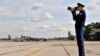 A Russian Air Force officer takes photos of the joint Russian-Serbian military exercises at an airport in Batajnica, near Belgrade, on October 13. 