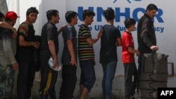 گروهی از مهاجران افغان که در ماه اپریل سال ۲۰۲۵ از ایران اخراج شده‌اند.