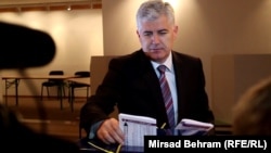 Dragan Covic casts his ballot. He campaigned on the creation of a Croat entity within Bosnia.