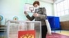 A woman casts her ballot in regional elections in Novosibirsk on September 13.