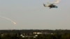 Украинский вертолёт Ми-24 во время операции по освобождению Донецкого аэропорта. 26 мая 2014 года