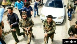 A TV image purportedly showing the detention of Iranian fighters in Syria who had been fighting regime forces.