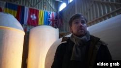 Danila Medvedev, one of the founders of KrioRus, stands in front of vats that contain the frozen remains of his customers. 