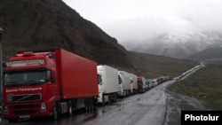 Georgia - Armenian and other heavy trucks are lined up on a road leading to the Georgian-Russian border crossing at Upper Lars, 6May2016.